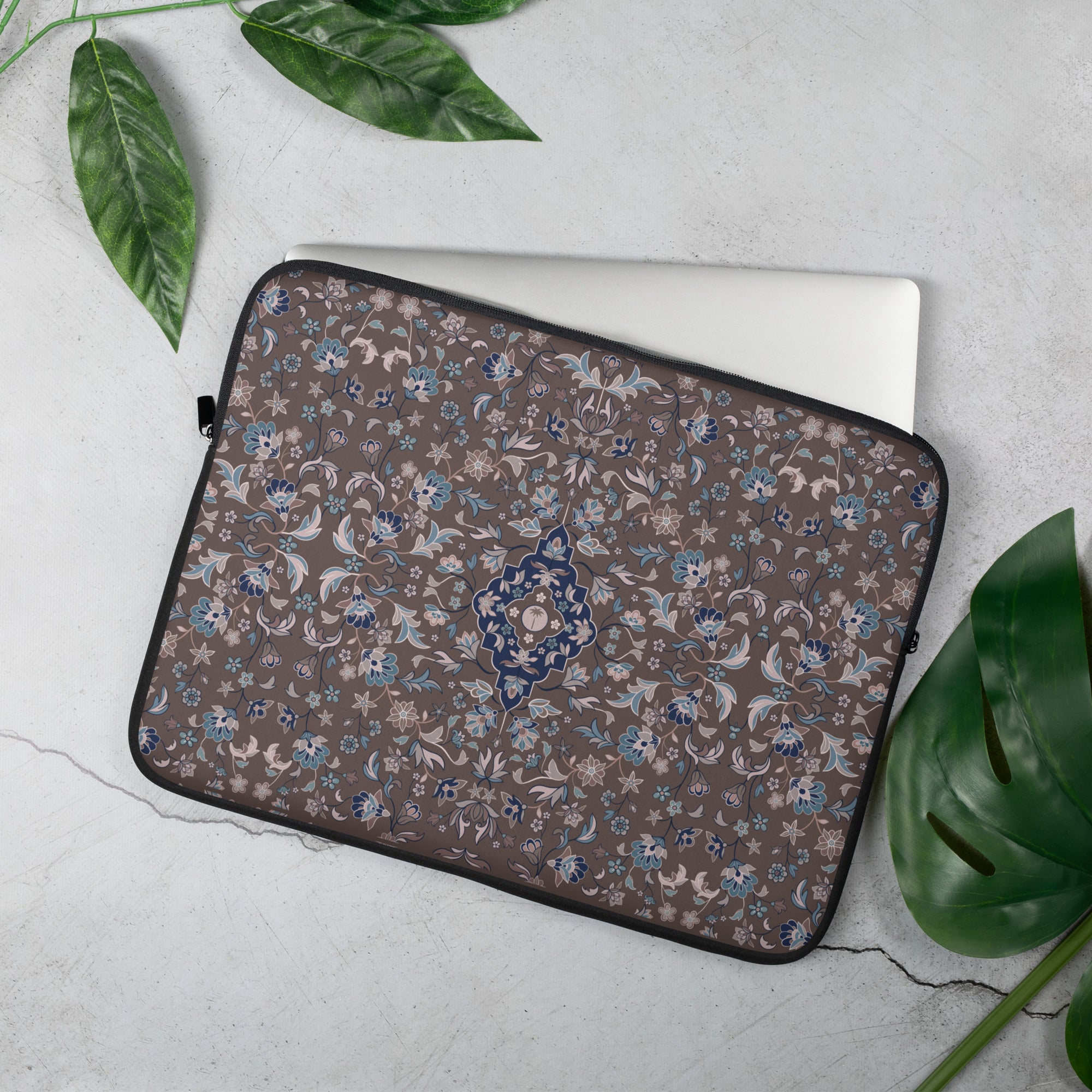 Haramain Brown Laptop Sleeve islamic gift with intricate carpet pattern on a brown background.